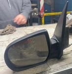 2001-2006 Mazda Tribute *black* Powered Non-heated Left Driver Door Mirror. Fixed Price $40.00.