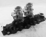 New Black Alumin 1949-1953 Ford Flathead V8 Dual Intake Manifold W/satin Carbs. Fixed Price $815.00.