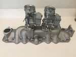 New Alumin 1949-1953 Ford Flathead V8 Dual Intake Manifold W/satin Carbs. Fixed Price $800.00.